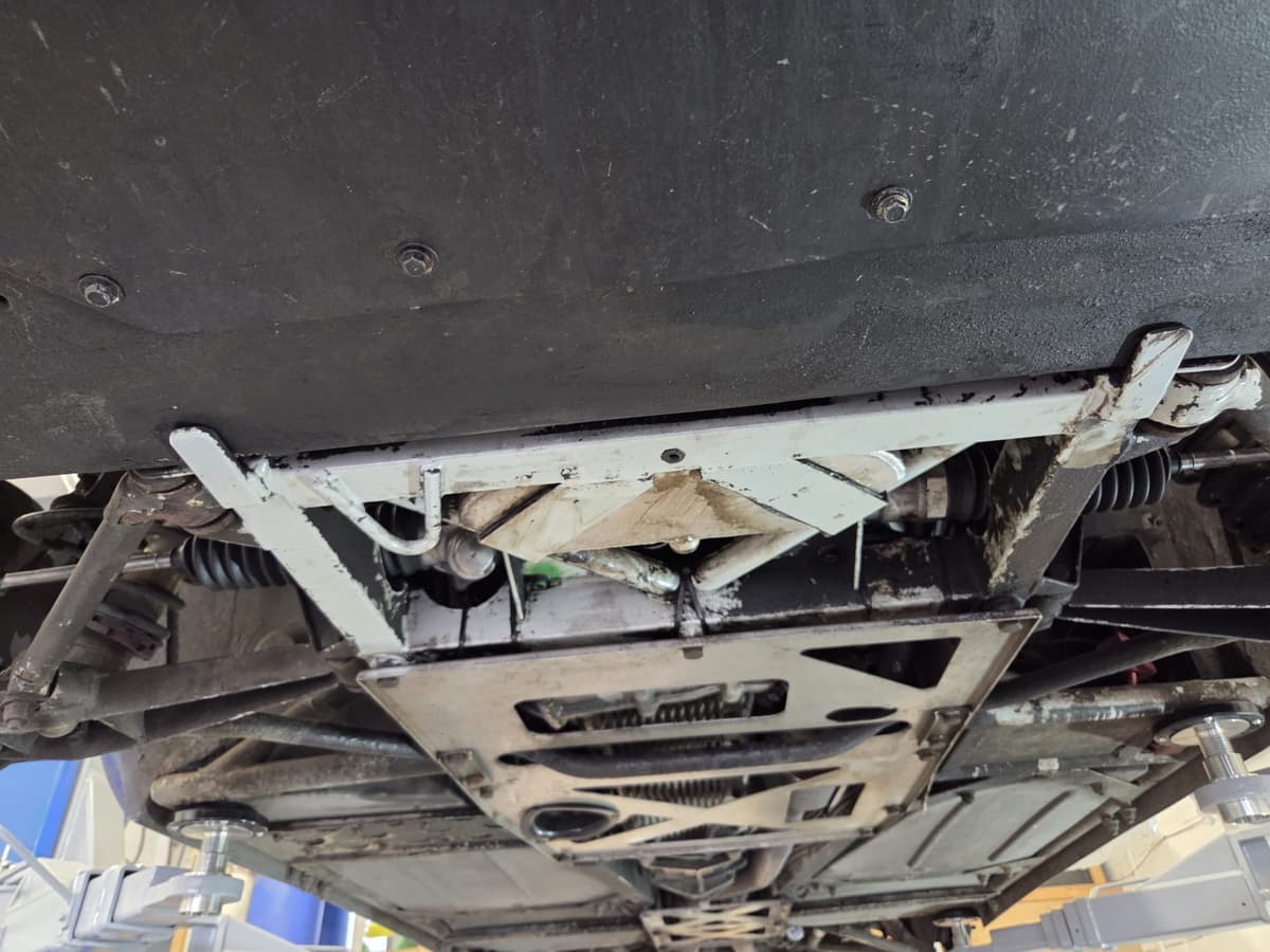 TVR Tuscan underside coated in road grime before dry ice cleaning